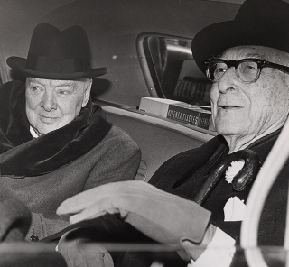 Churchill & Baruch talk in car in front of Baruch's home