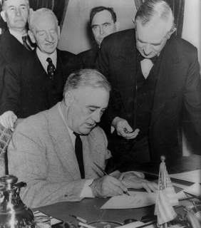 President Roosevelt signing the Declaration of war against Japan