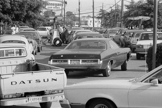 Cars wait in lines for gas