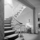 Residence, Lloyd Bacon, Interior, lower stair hall: Photographer: Maynard L. Parker, The Huntington Library, San Marino, California